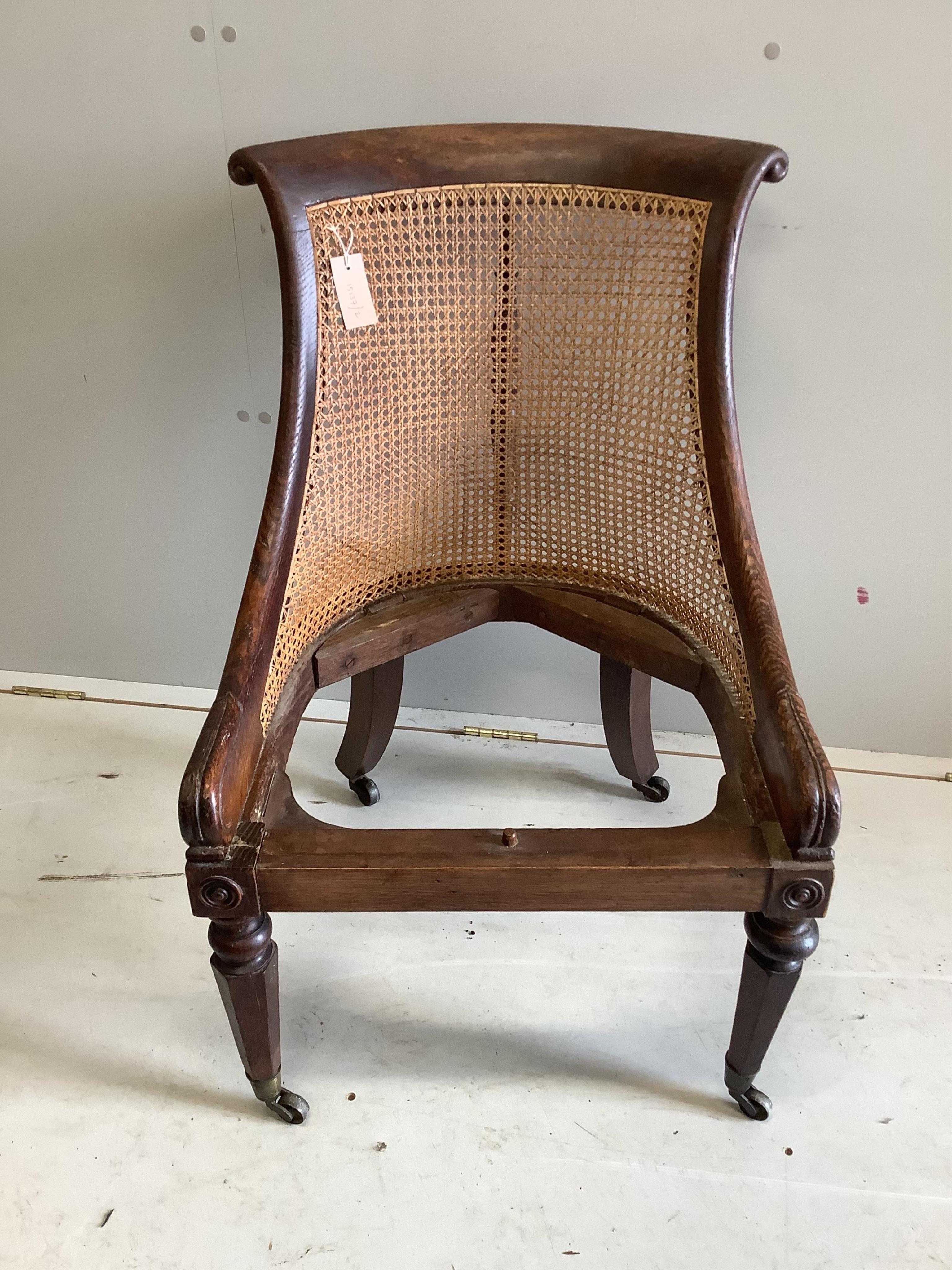 A Regency simulated rosewood oak bergere chair, width 54cm, depth 60cm, height 81cm. Condition - fair